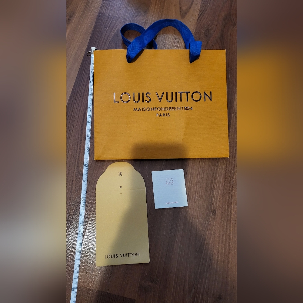 Small Louis Vuitton shopping bag with tags